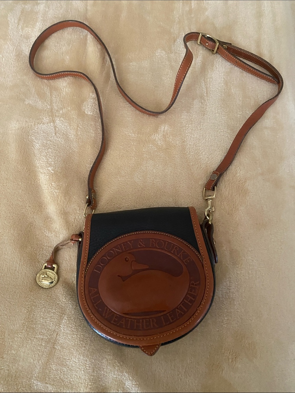 Dooney & Bourke Black and Brown Leather Bitsy Crossbody Saddle Bag w/Medallion